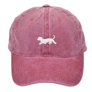 Vintage washed burgundy baseball cap with white dog embroidery and adjustable fit