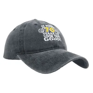 Dark grey washed cotton baseball cap with 70th birthday embroidery on a white background