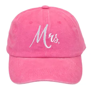 Close-up of Mrs. embroidery on rose pink washed cotton baseball cap with white script