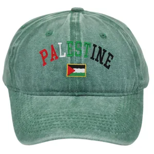 Detail of Palestine flag embroidery and text on vintage washed green cotton baseball cap