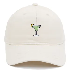 Off-white cotton baseball cap featuring green margarita cocktail embroidery on front