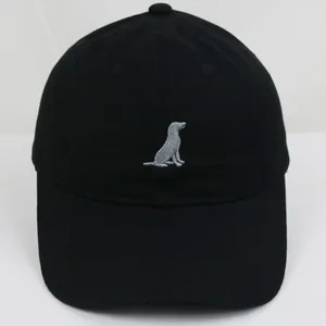Close-up of gray dog embroidery on a black cotton baseball cap with classic texture