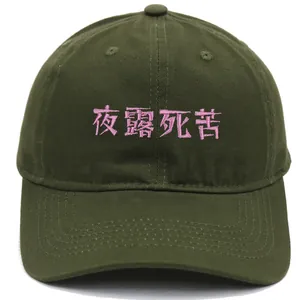 Close-up of pink embroidery on military green cotton baseball cap with stitch detail