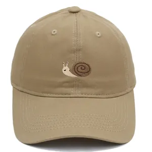 Close-up of khaki baseball cap featuring detailed snail embroidery and premium cotton twill
