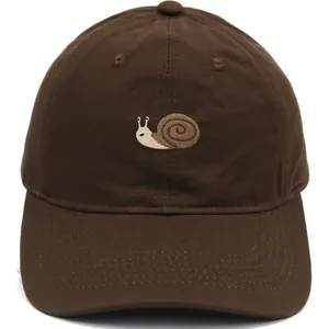 Dark brown cotton baseball cap with detailed snail embroidery on a plain white background