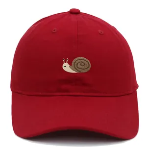Red cotton baseball cap featuring embroidered snail pattern and breathable sun visor