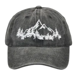 Detailed close-up of mountain forest embroidery on washed cotton baseball cap