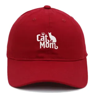 Detailed white Cat Mom embroidery and cat silhouettes on a red cotton baseball cap