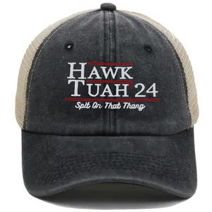Close-up of Hawk Tuah 24 embroidery on washed grey and beige mesh trucker hat