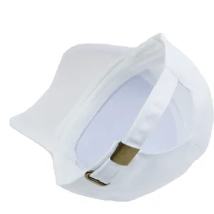 Detail of adjustable bronze metal buckle and cotton canvas texture on white baseball cap