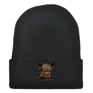 Classic black ribbed knit beanie featuring a detailed highland cow embroidery on the front