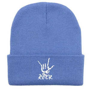 Close-up of light blue ribbed beanie featuring white ROCK hand gesture embroidery