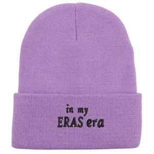Purple ribbed knit beanie with black in my ERAS era embroidery on the folded cuff