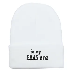 White knit beanie hat featuring black in my ERAS era embroidery on folded cuff