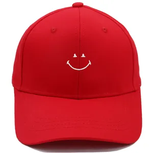 Bright red cotton baseball cap featuring white smile embroidery for casual summer wear
