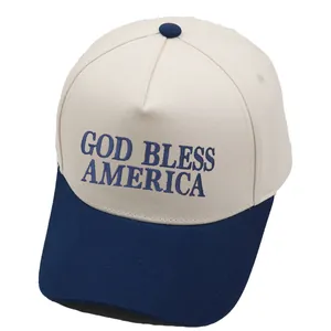 Cream and navy trucker hat featuring God Bless America embroidery on cotton twill fabric