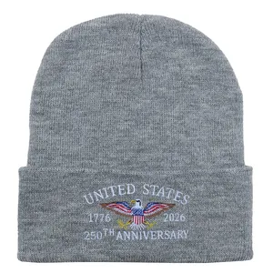 Detail of white embroidery for United States 250th anniversary on gray knitted beanie
