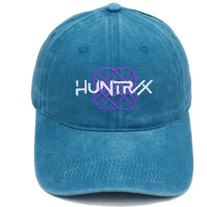 Detail of washed blue baseball cap featuring white HUNTRX embroidery and purple geometric lines