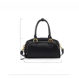 Black vintage bowling bag with gold hardware and dimensions 33cm x 18cm x 11cm