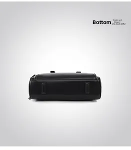 Detailed bottom view of black leather bowling bag showing reinforced patches and stitching