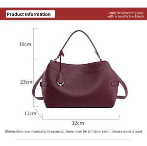 Detailed size chart for burgundy handbag showing 32cm width and 23cm height with handle
