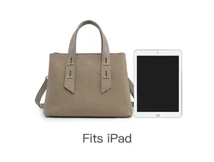 Macro view of Togo leather tote bag showing capacity to fit a standard iPad device