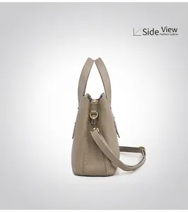 Side view of structured grey Togo leather handbag with gold hardware and shoulder strap