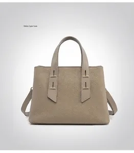 Back view of the light brown TOGO leather tote bag with a structured trapezoid design