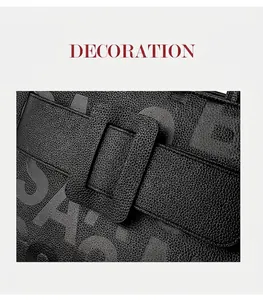 Detail of black pebbled leather tote bag with embossed letters and large buckle design
