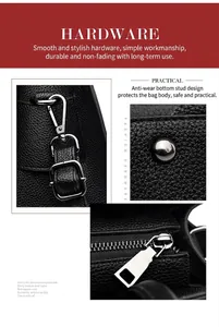 Detail of black pebbled leather tote showing D-ring hardware and protective bottom studs