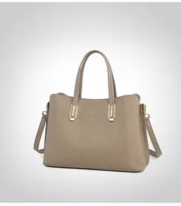 Detail view of the side profile of this premium pebbled leather tote with gold hardware