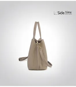 Side view of elegant grey pebble leather tote bag with gold hardware and side outline
