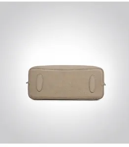 Detailed base view of genuine leather tote bag showing oval reinforcement patches