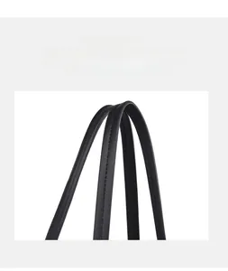 Detail of black leather tote strap with precise double-row stitching and fine texture