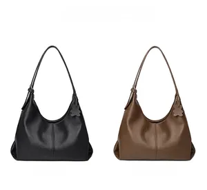 Hobo shoulder bag in black and khaki colors with lychee texture and bear pendant detail