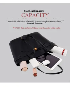 Spacious black leather tote showing interior capacity for iPad, umbrella and essentials