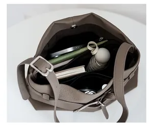 Macro top view of large tote bag interior showing spacious compartments and magnetic closure