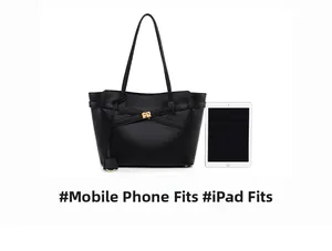 Black leather tote bag interior showing spacious capacity for iPad and smartphone