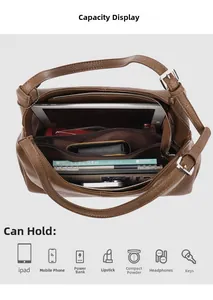 Internal capacity display of large brown lychee leather tote bag showing iPad storage