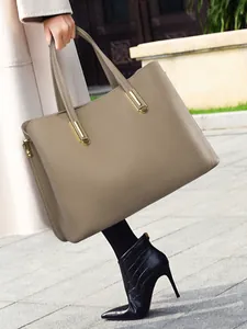 Brown lychee leather tote bag with gold hardware for office and commuting