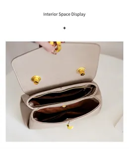 Detailed interior of a beige leather tote bag showing double compartments and zipper pocket