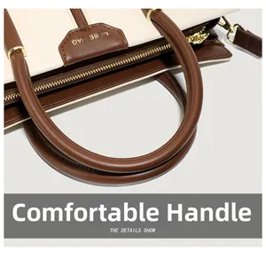 Close-up of contrast color handbag with MUSE BAG leather label and sturdy handles