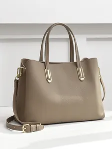Genuine leather tote bag with pebble grain texture and golden hardware in taupe color