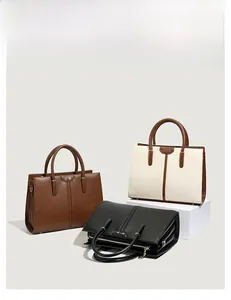 Three color variants of minimalist tote bags with metal hardware and pebbled texture