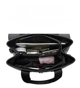 Internal structure of black litchi pattern leather tote bag showing high capacity storage