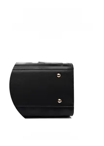Close-up of golden protective metal studs and embossed leather texture on handbag base