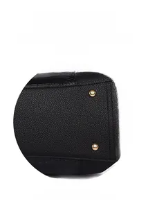 Detail of black pebbled leather tote base with crocodile pattern and gold bottom studs