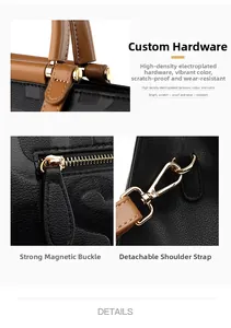 Detail view of gold hardware, magnetic closure, and removable strap on black leather tote