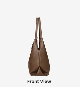 Side view detail of a brown tote bag showing its premium lychee grain leather texture