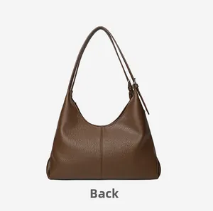 Back view of brown pebble leather hobo shoulder bag with adjustable silver buckle strap